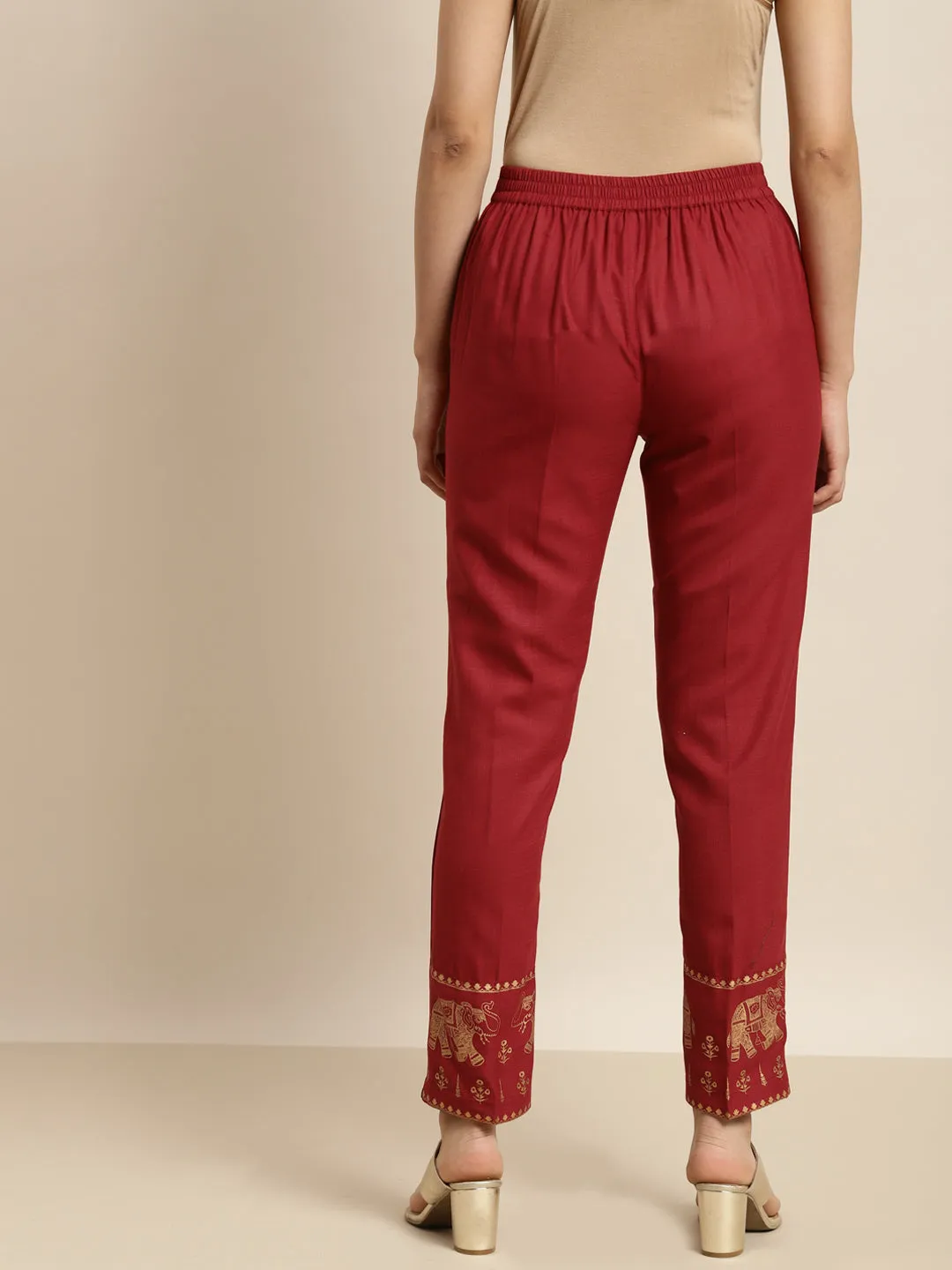 Women Maroon Elephant Border Foil Print Pencil Pants